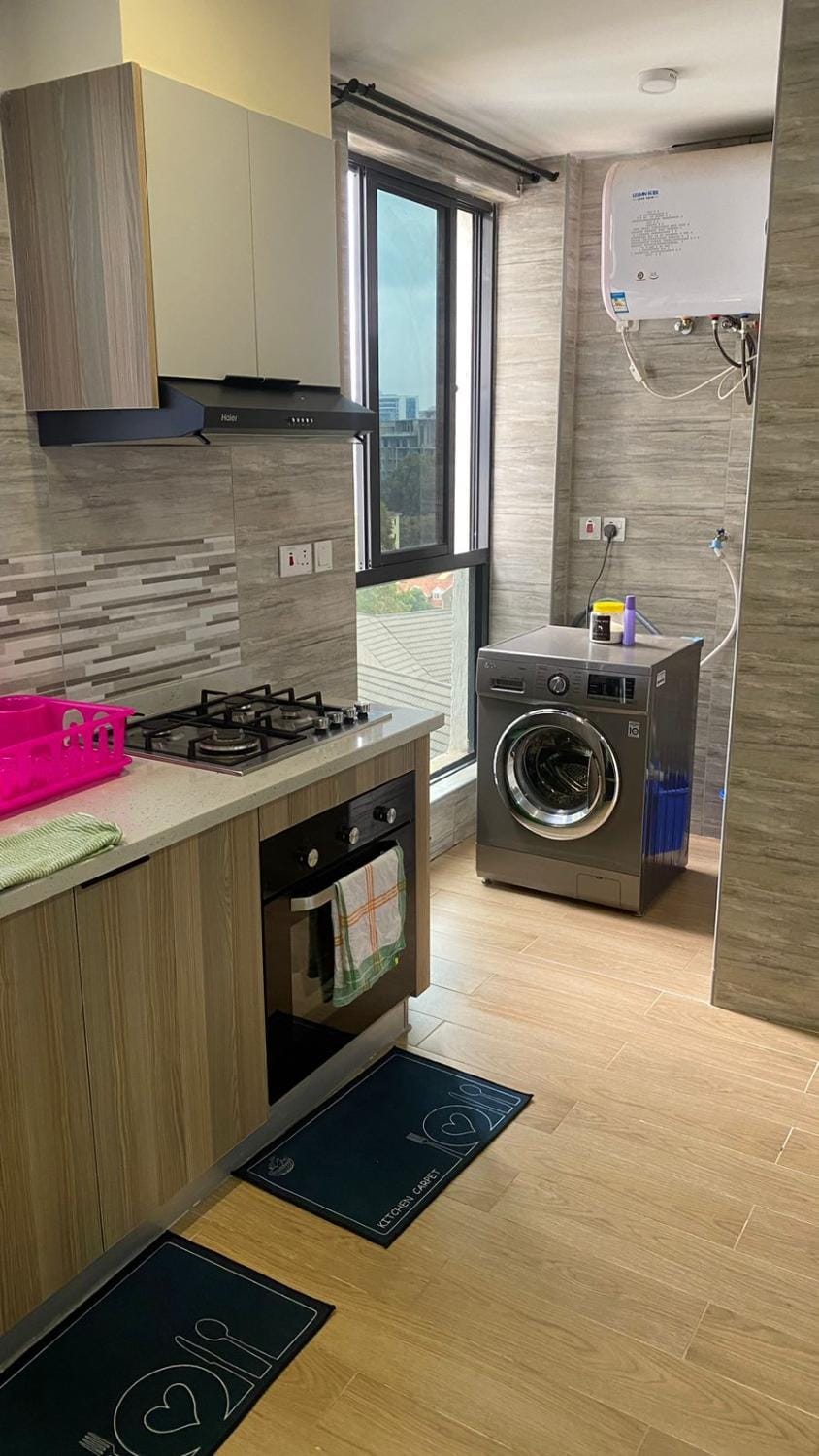 stunning two bedroom apartment with swimming pool, fully equipped gym, private parking space, children playground and unbeatable scenic city views Apartment in Nairobi