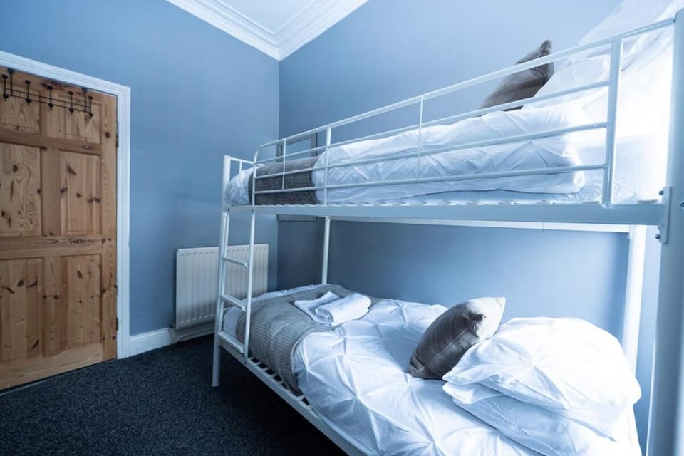 Photo of the whole room, bunk bed, towels, wardrobe