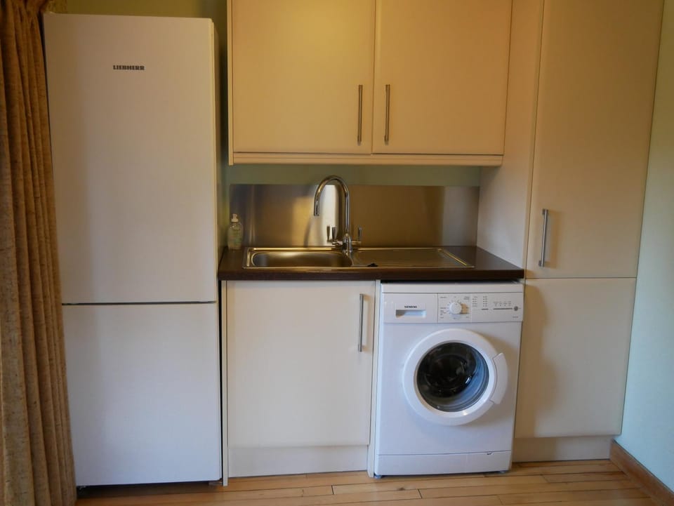 Kitchen or kitchenette, washing machine