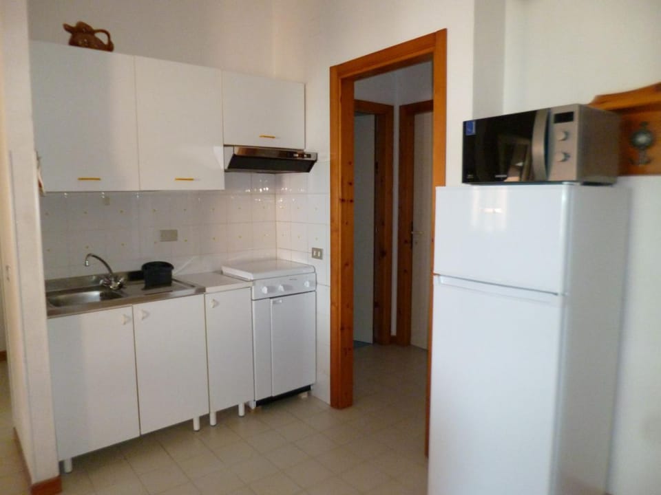 Kitchen or kitchenette, oven, stove