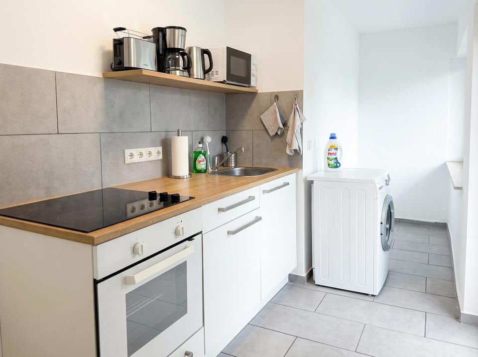 Kitchen or kitchenette, stove, washing machine, kitchen