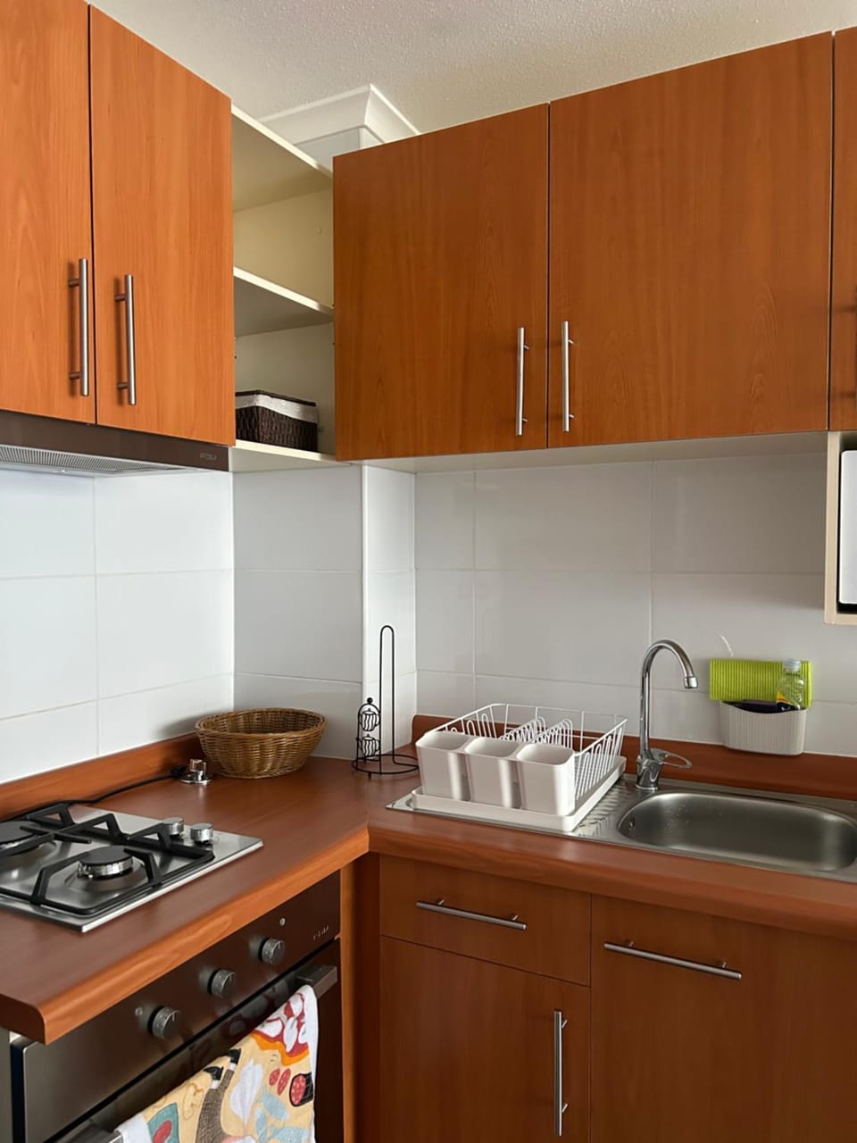 Kitchen or kitchenette, dishwasher, stove, toaster