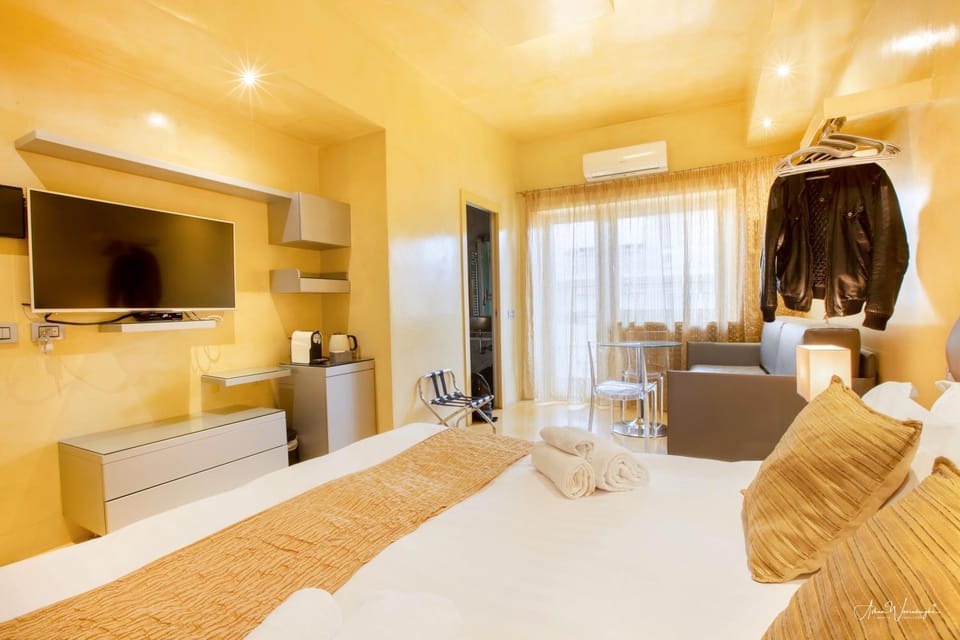 Communal lounge/ TV room, Bed, Photo of the whole room, Seating area, towels, air conditioner