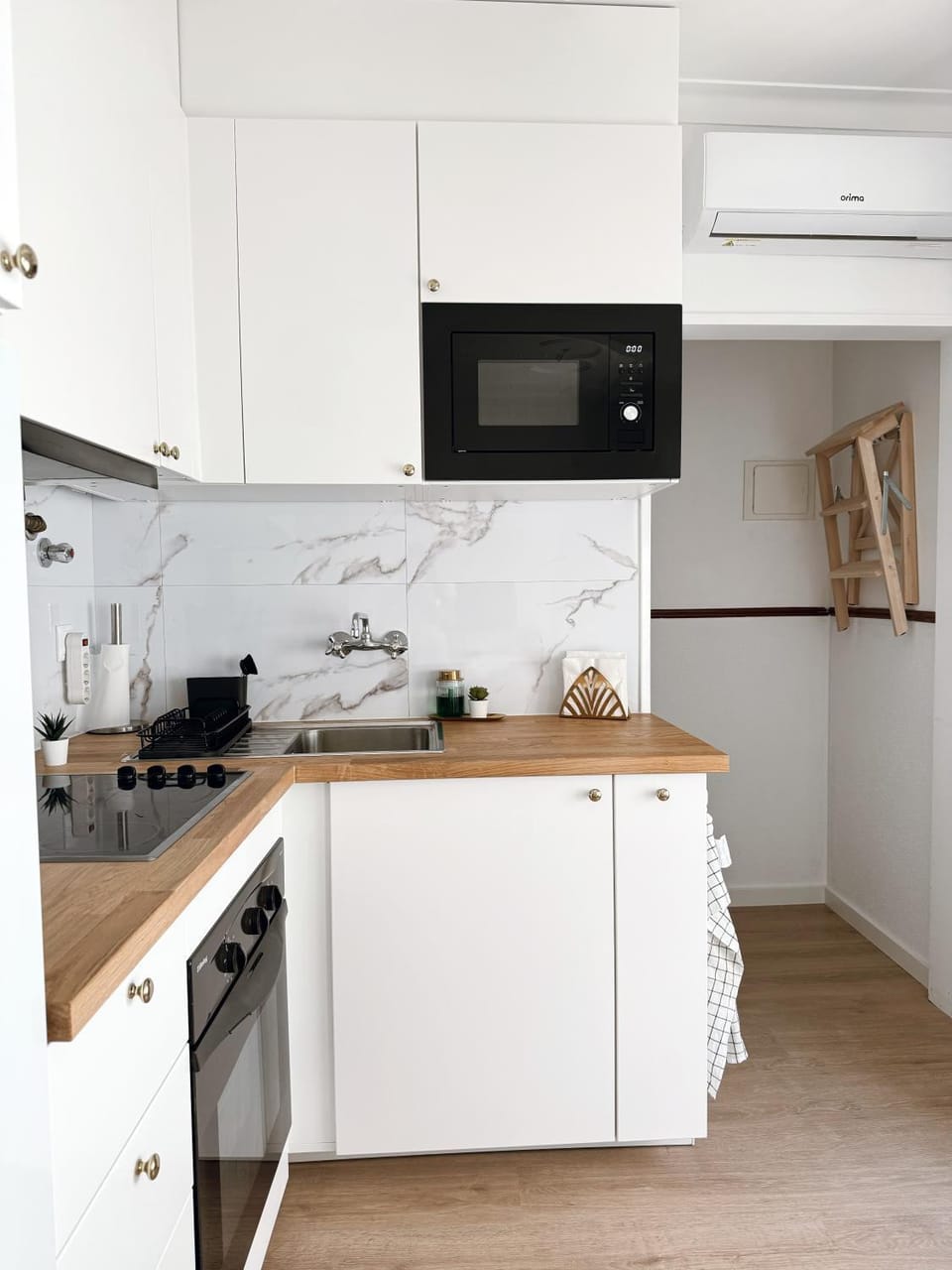 Kitchen or kitchenette, oven, stove, air conditioner