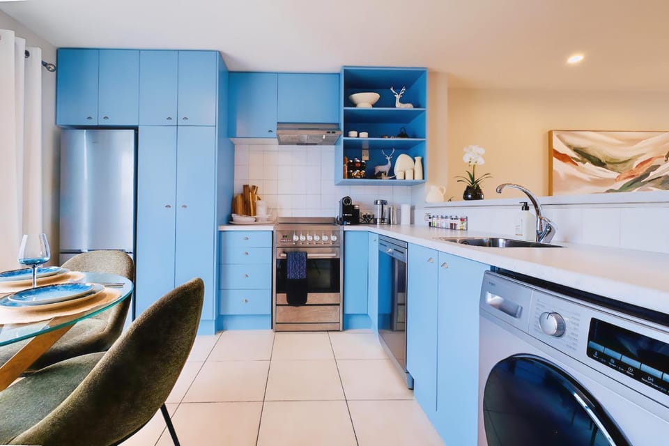 Kitchen or kitchenette, dishwasher, oven, stove, washing machine, dryer