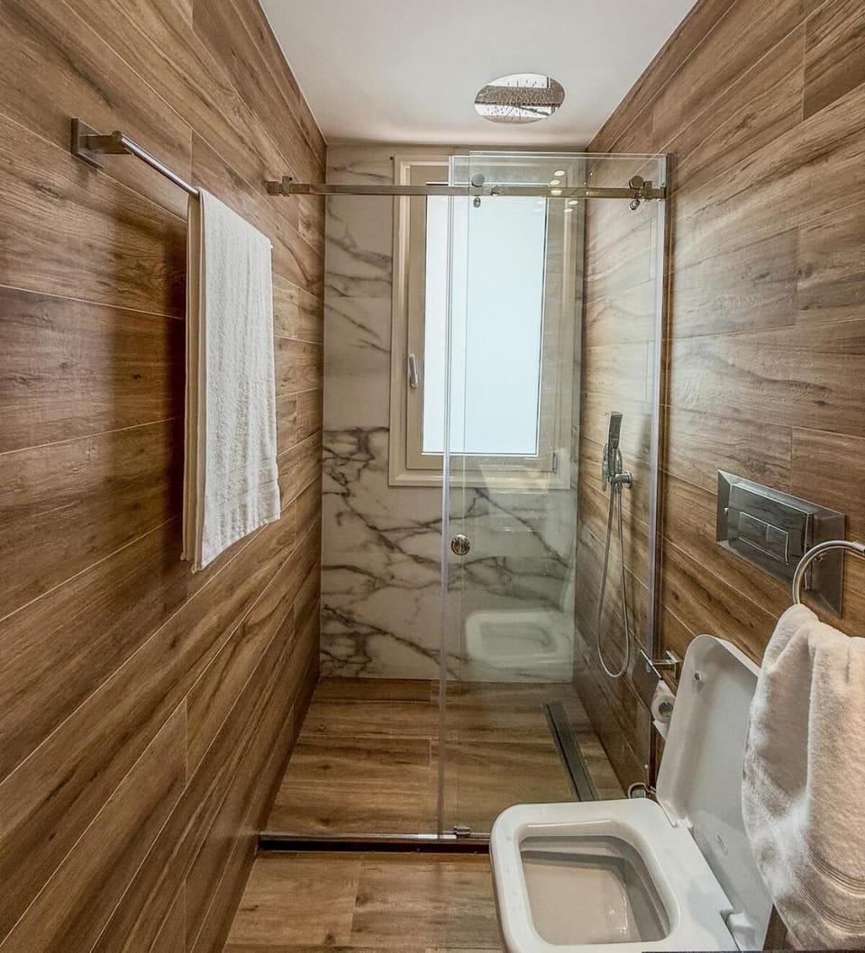 Toilet, Bathroom, Living room, Seating area