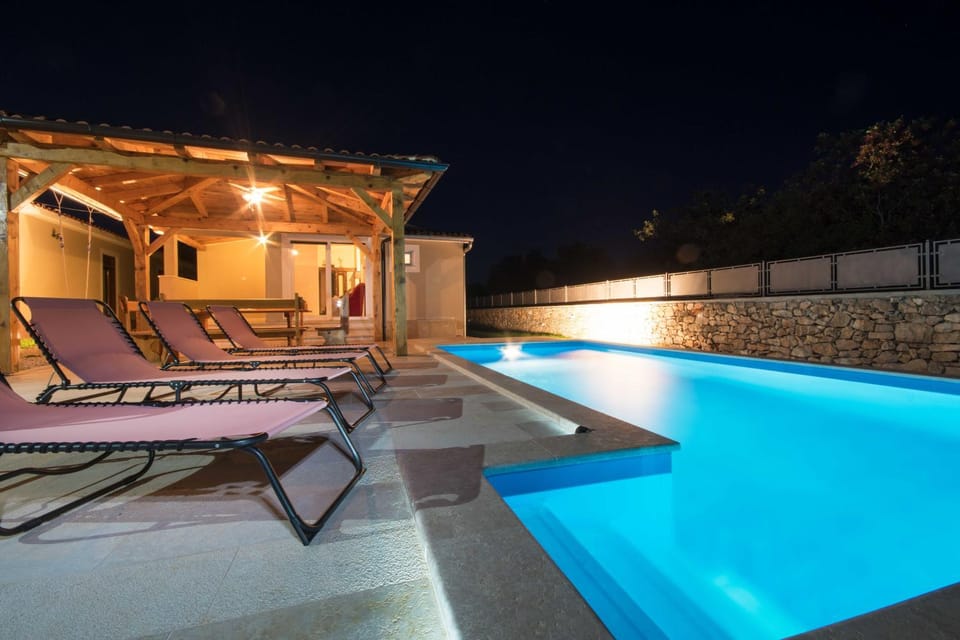Patio, Night, Pool view, Swimming pool, sunbed