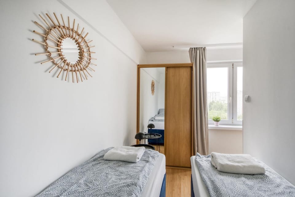 Bed, towels, wardrobe