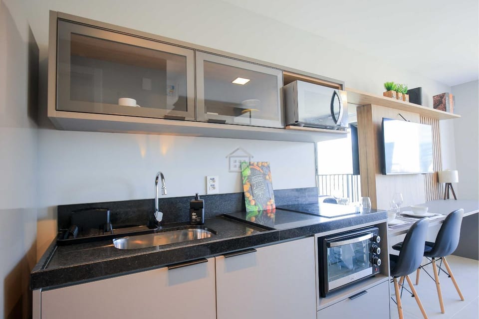 Kitchen or kitchenette, microwave, oven, stove
