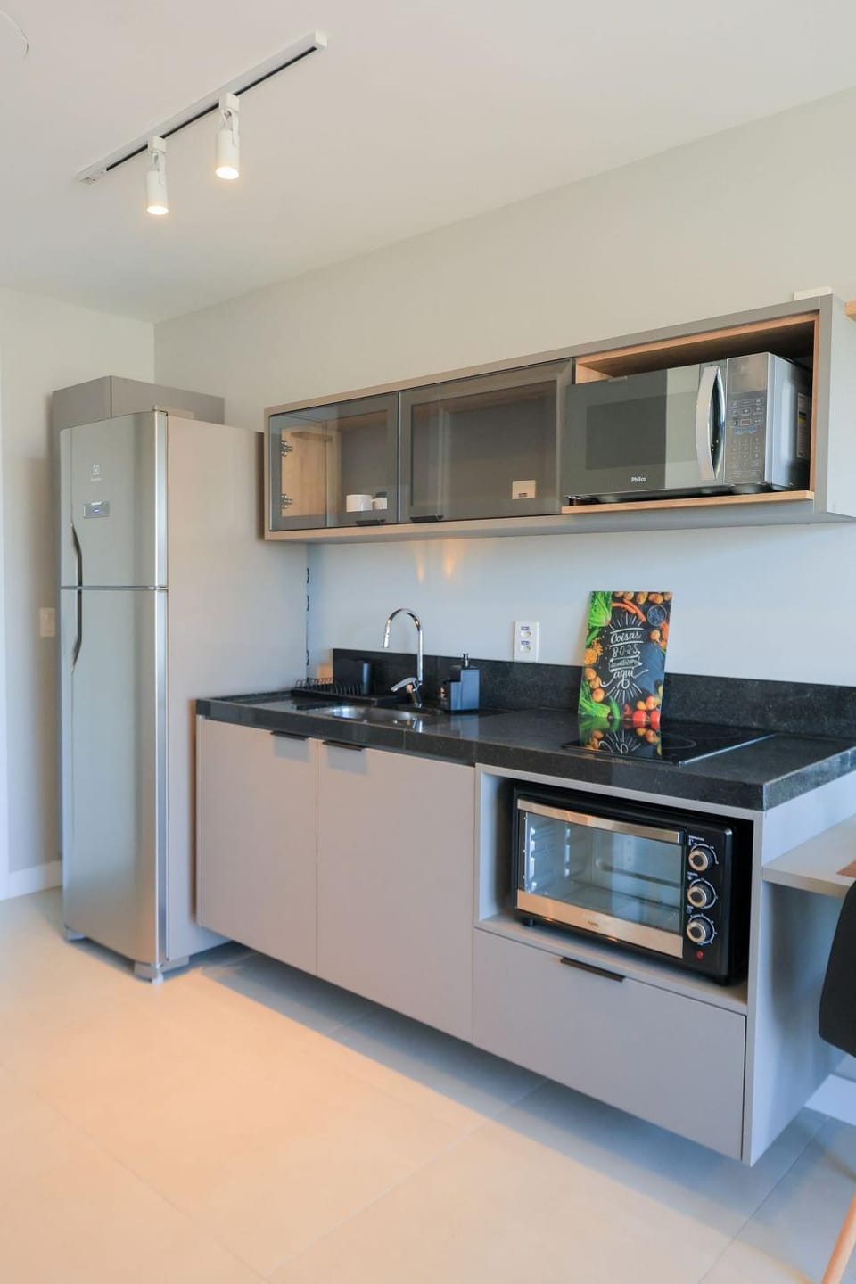 Kitchen or kitchenette, microwave, oven, stove
