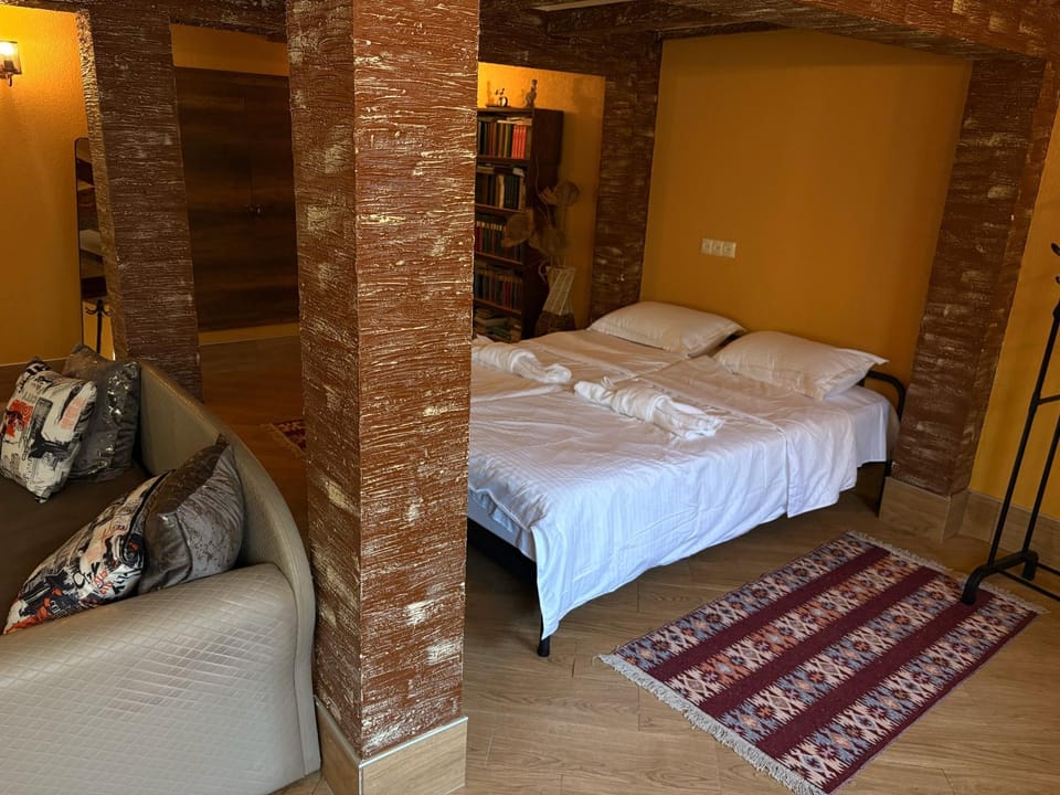 Bed, Living room, Seating area, Bedroom