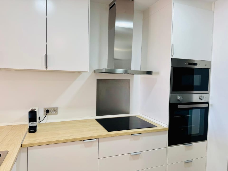Kitchen or kitchenette, dishwasher, oven, stove