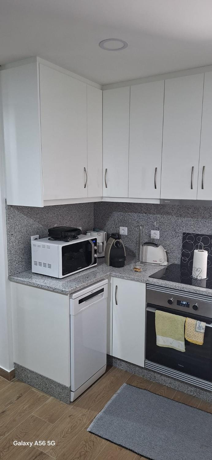 Kitchen or kitchenette, dishwasher, microwave, oven