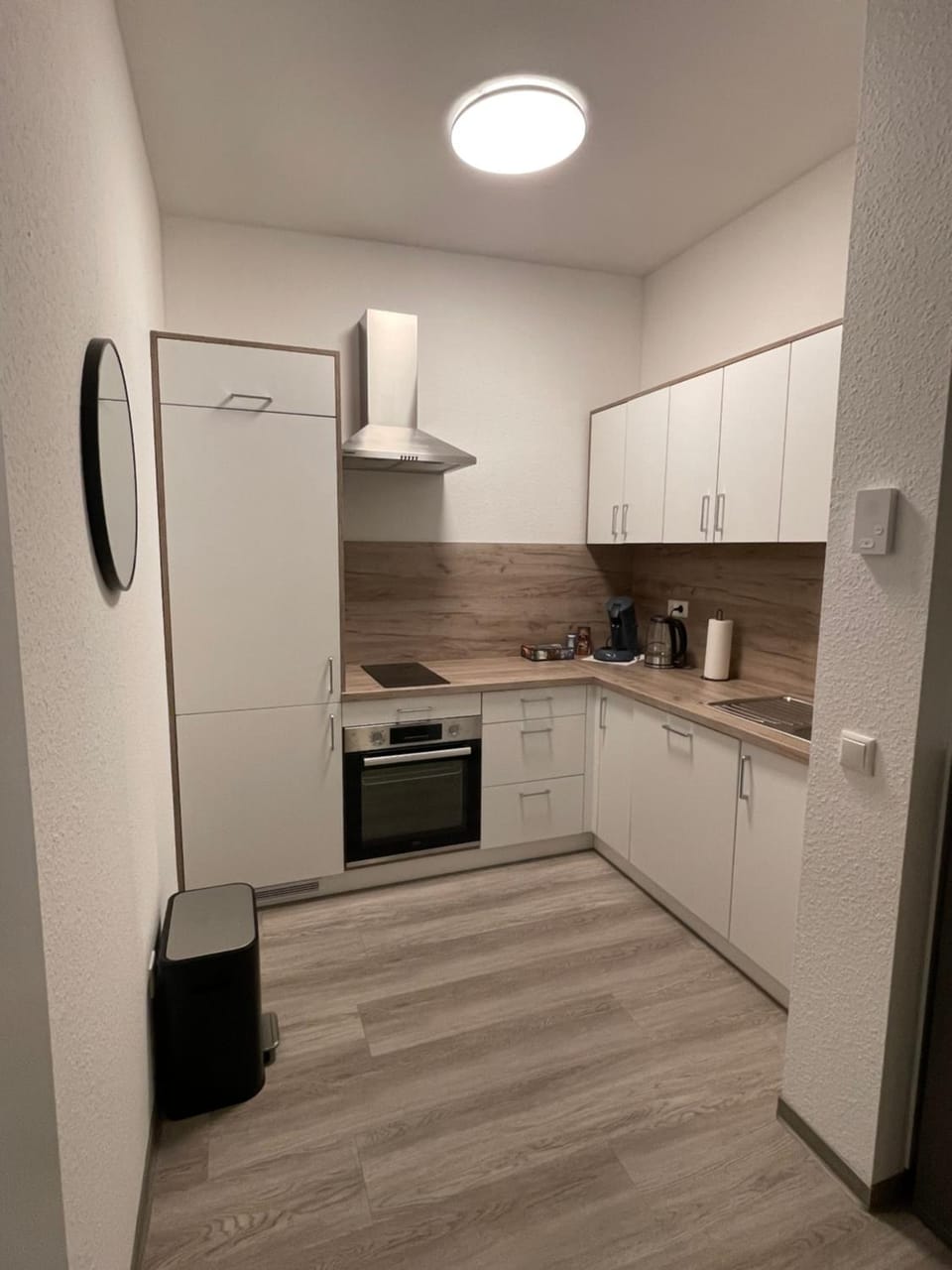 Kitchen or kitchenette, dishwasher, oven, stove