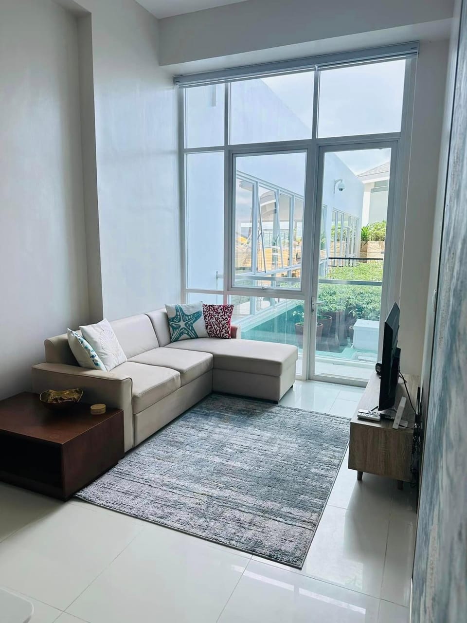 Living room, Seating area, Pool view