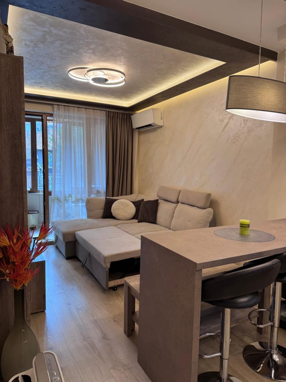 Bed, TV and multimedia, Living room, Seating area, air conditioner
