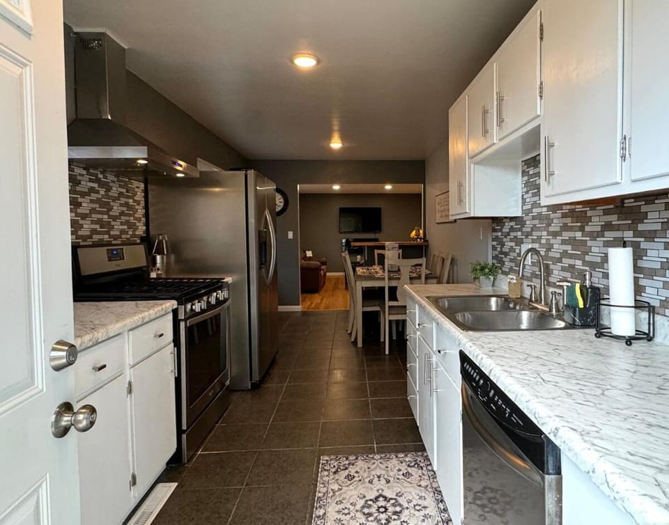 Kitchen or kitchenette, dishwasher, oven, stove