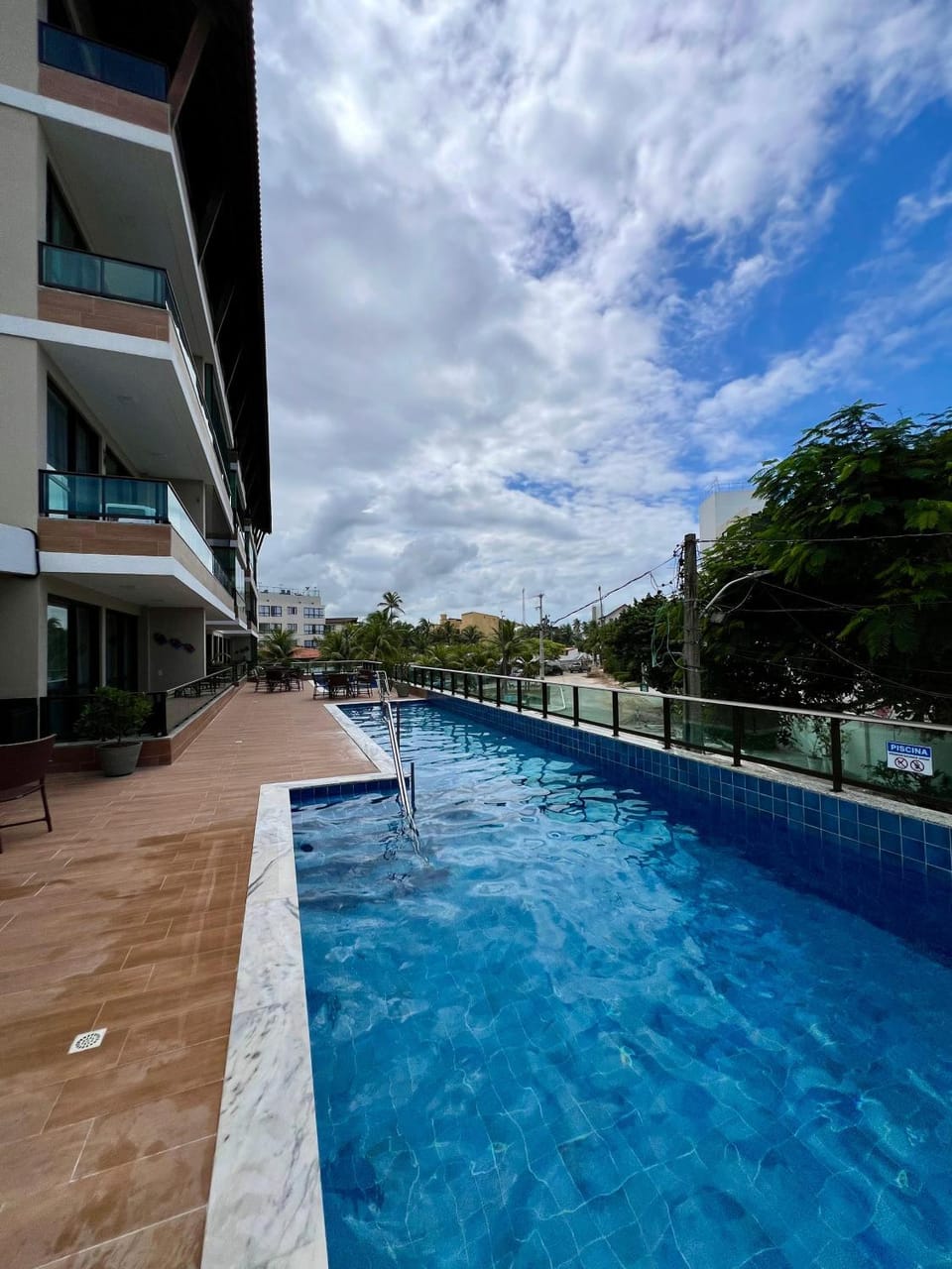 Property building, Day, Pool view, Swimming pool, sunbed