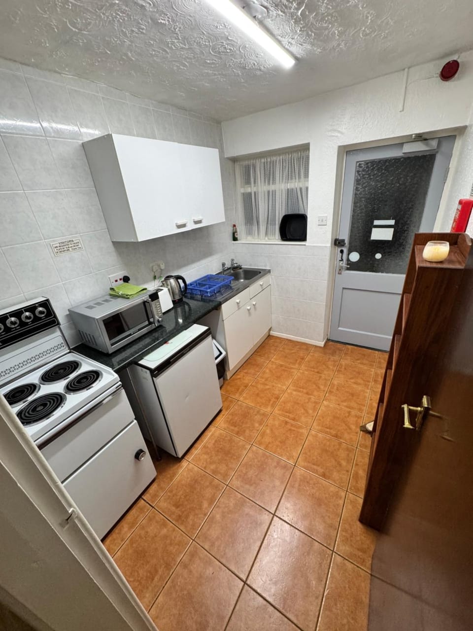 Kitchen or kitchenette, oven, toaster
