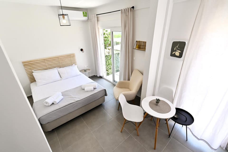 Photo of the whole room, Seating area, Bedroom, towels, air conditioner