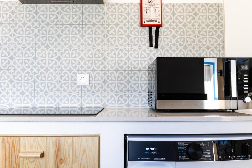 Kitchen or kitchenette, microwave, stove, dryer