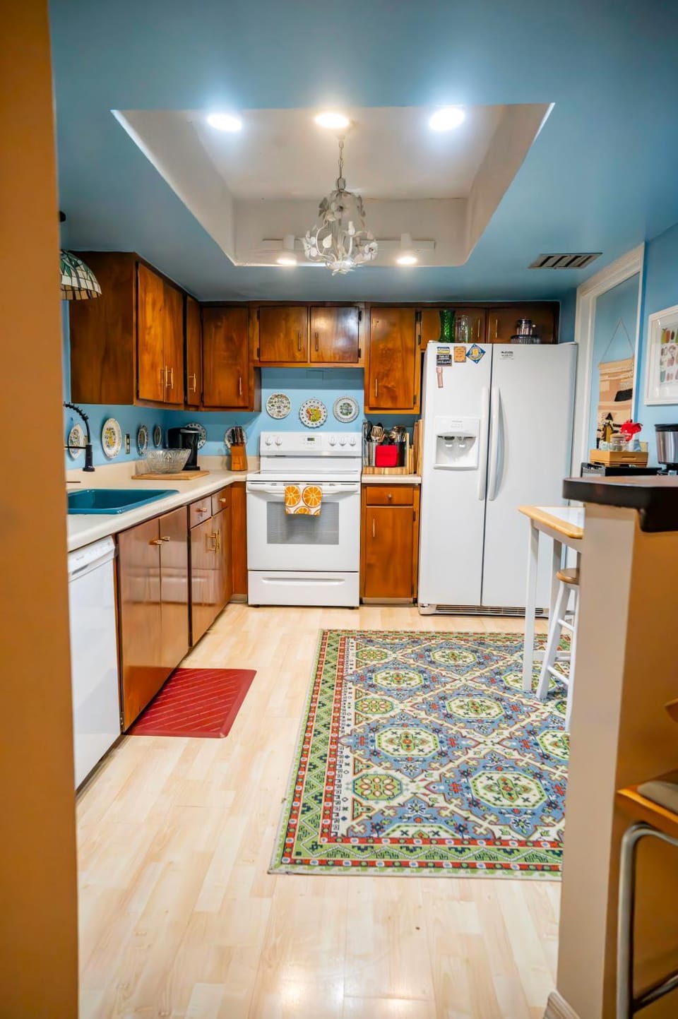 Kitchen or kitchenette, dishwasher, oven, stove