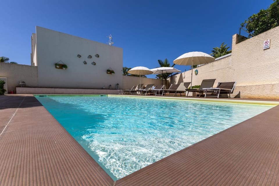 Property building, Living room, Swimming pool