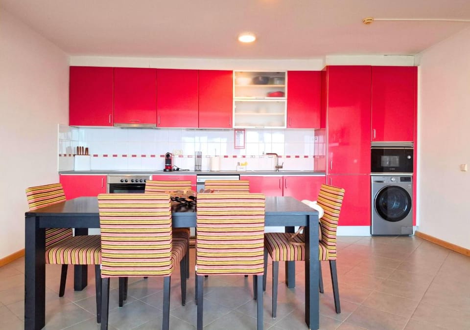 Kitchen or kitchenette, Living room, Dining area, dishwasher, oven, stove, toaster, washing machine