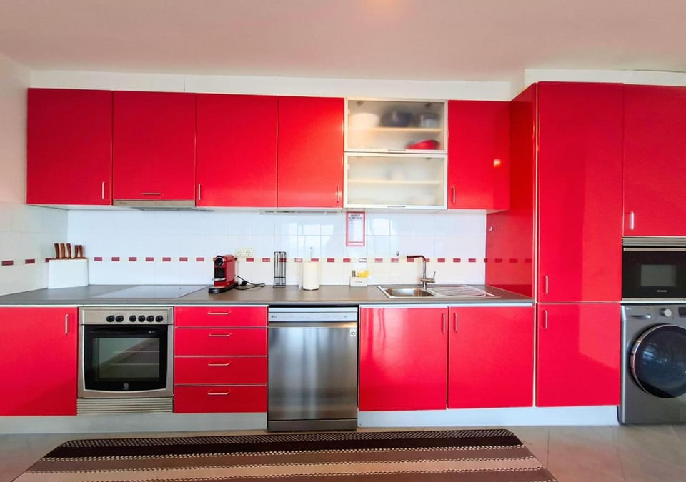 Kitchen or kitchenette, dishwasher, oven, stove, toaster, washing machine