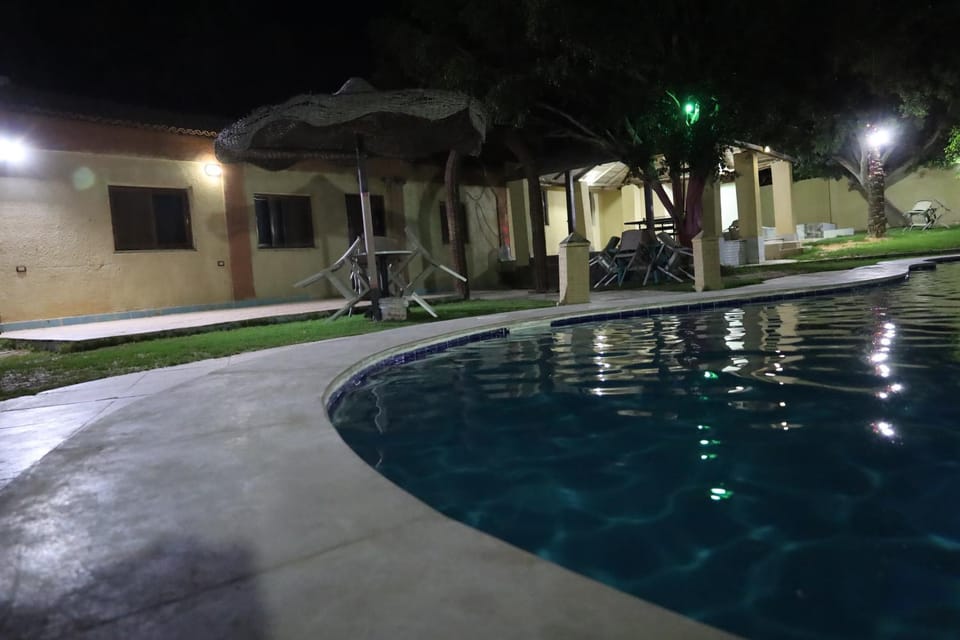 Property building, Night, Pool view, Swimming pool