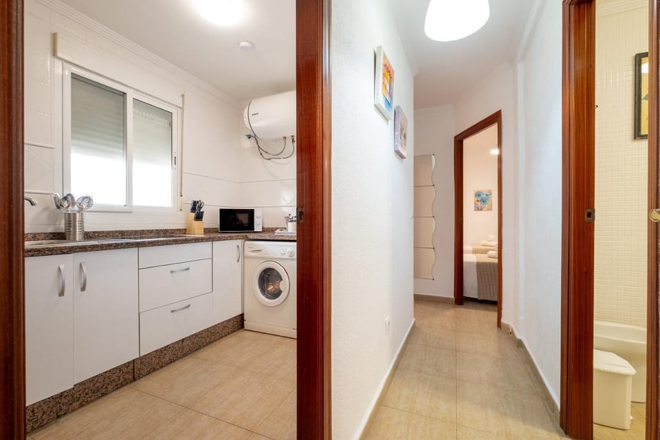 Kitchen or kitchenette, Bedroom, microwave, stove, washing machine