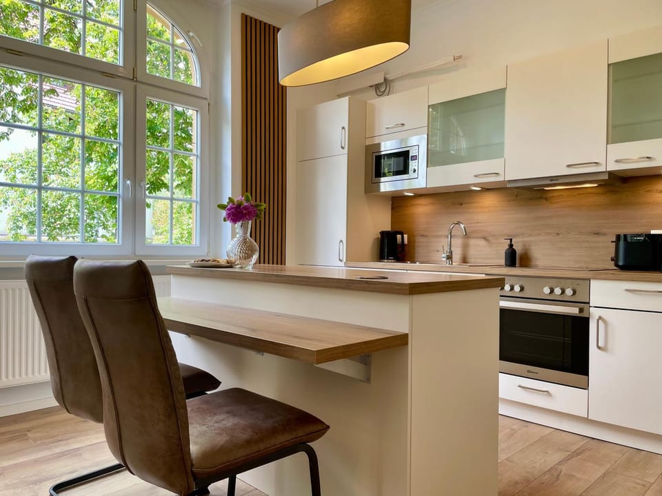 Kitchen or kitchenette, dishwasher, oven, stove, toaster