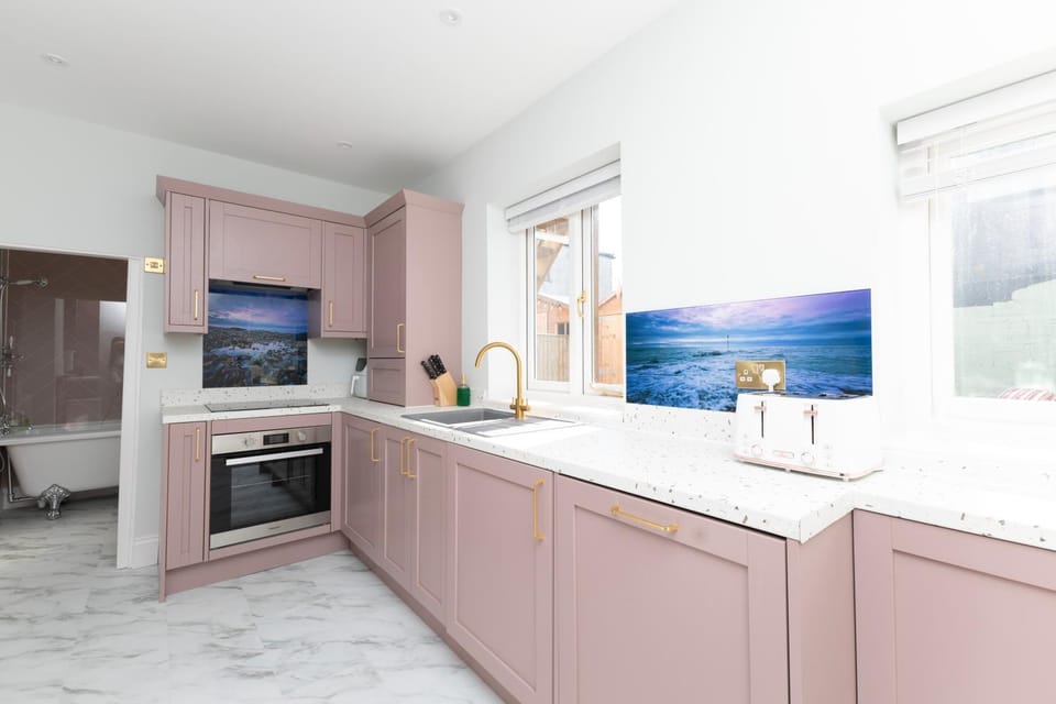 Kitchen or kitchenette, dishwasher, oven, stove