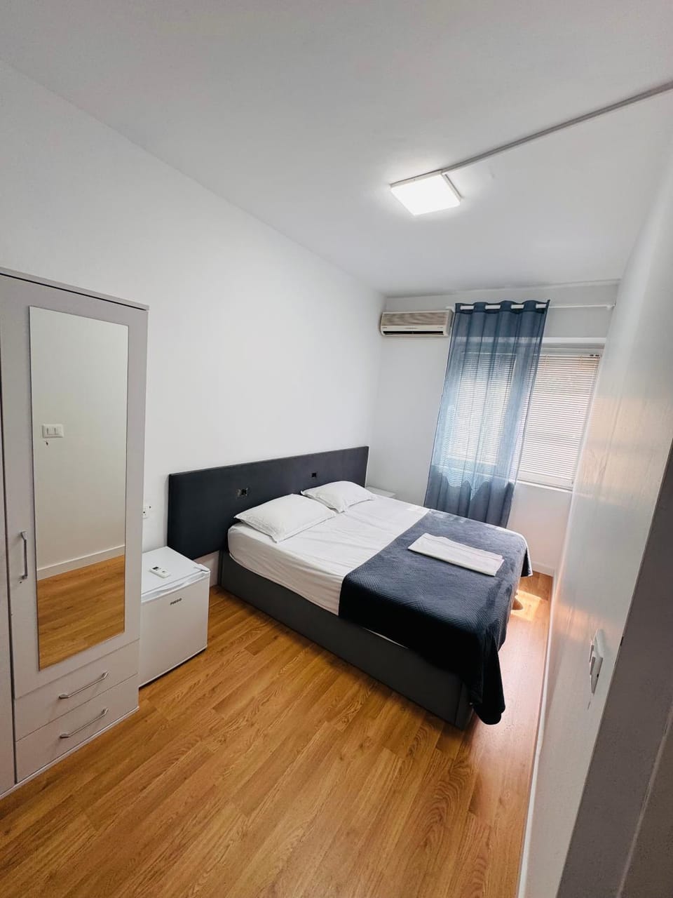 Bed, Photo of the whole room, Bedroom, towels, air conditioner
