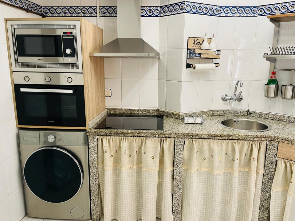 Kitchen or kitchenette, microwave, oven, stove, washing machine