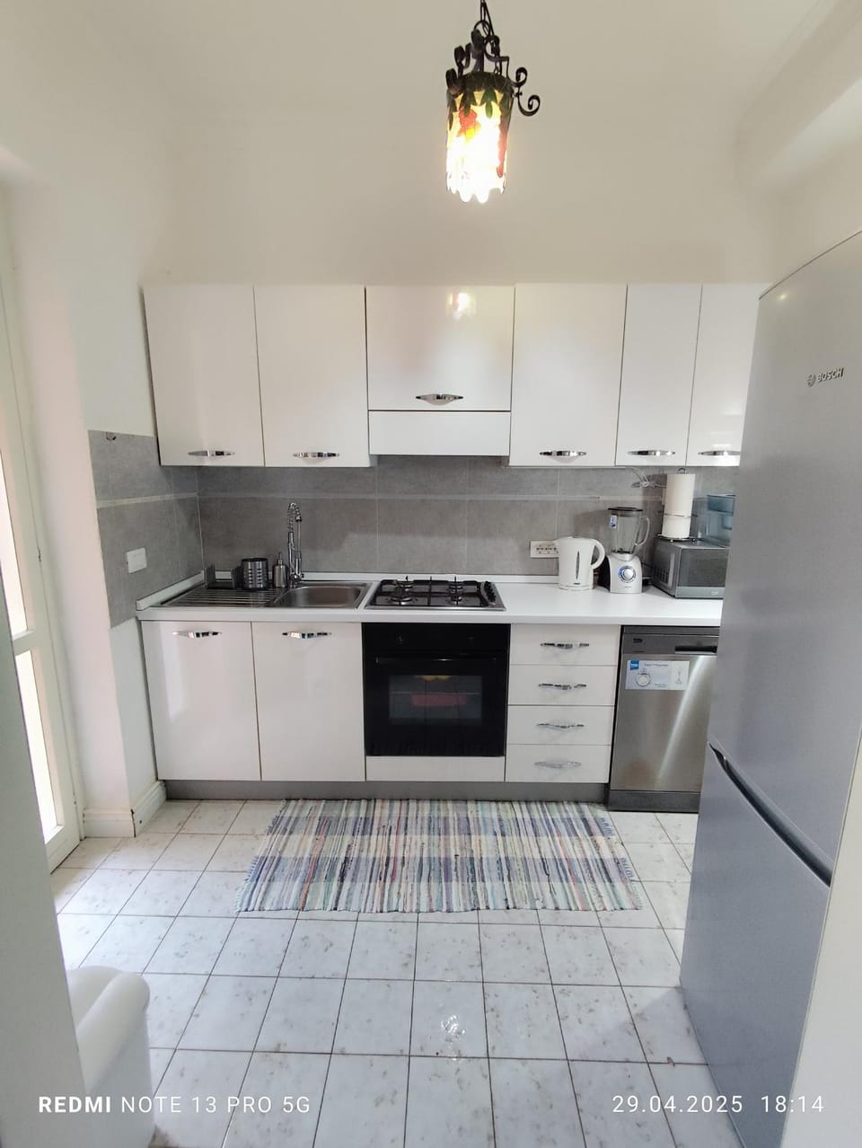 Kitchen or kitchenette, dishwasher, oven, stove