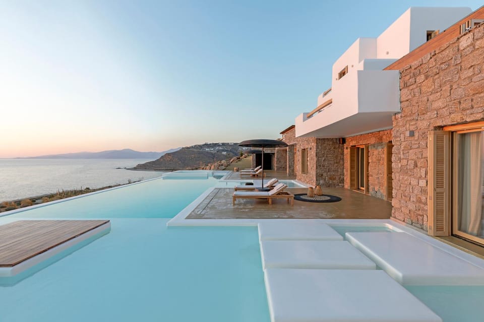 Property building, Patio, Natural landscape, Pool view, Sea view, Swimming pool, sunbed