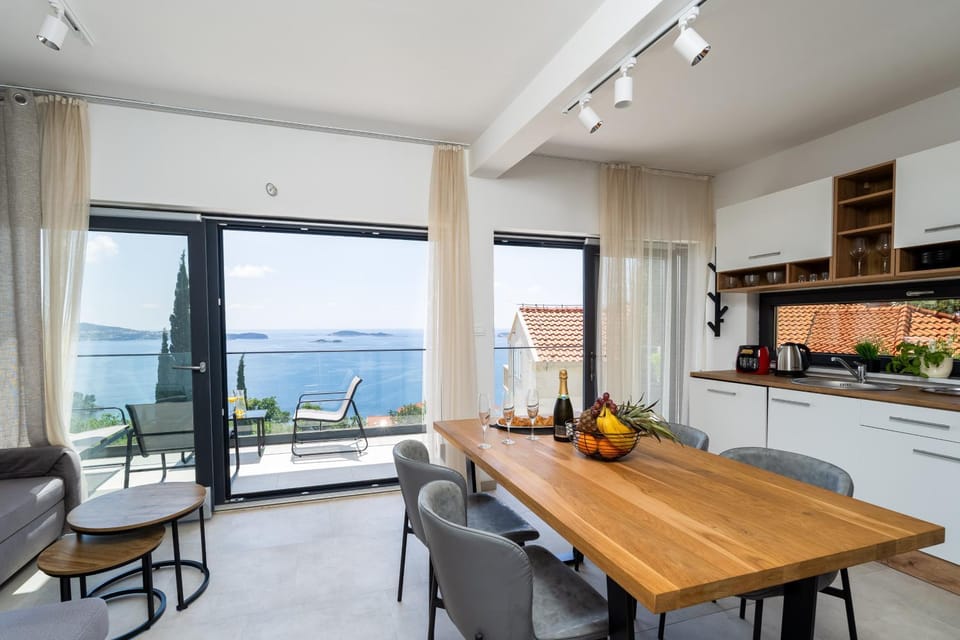 Kitchen or kitchenette, Living room, Seating area, Dining area, Sea view