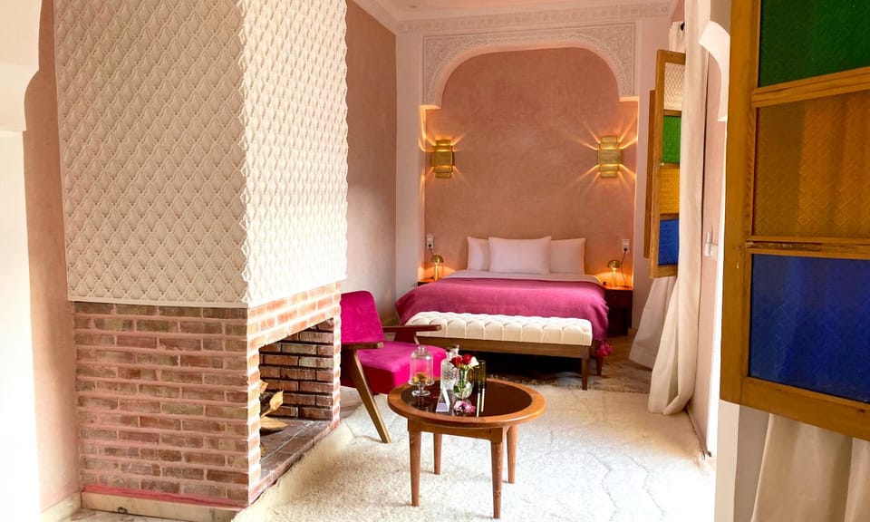 Bed, Seating area, Bedroom, fireplace