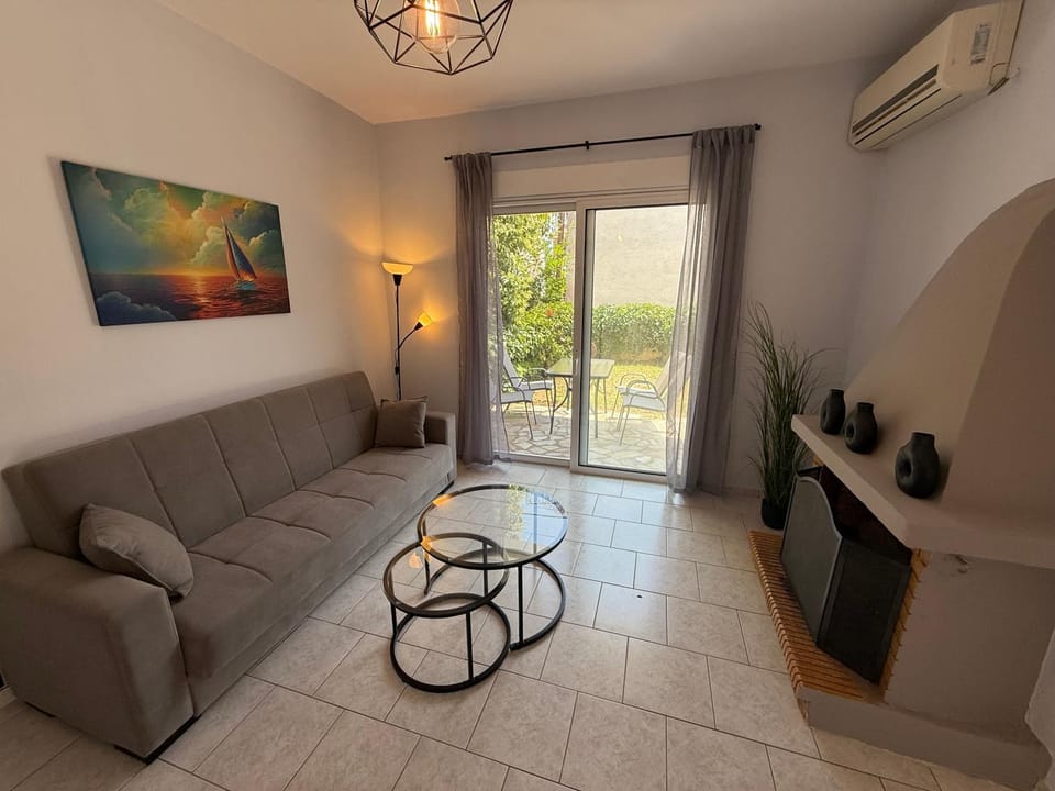 TV and multimedia, Living room, Seating area, fireplace, air conditioner