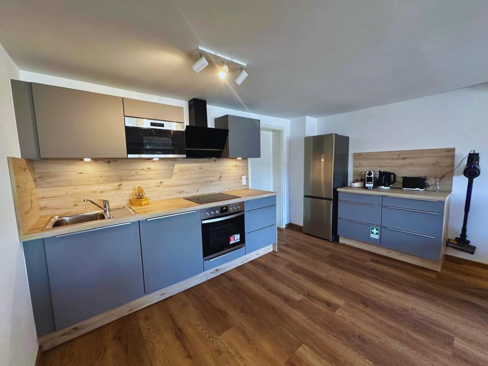 Kitchen or kitchenette, dishwasher, oven, stove, toaster
