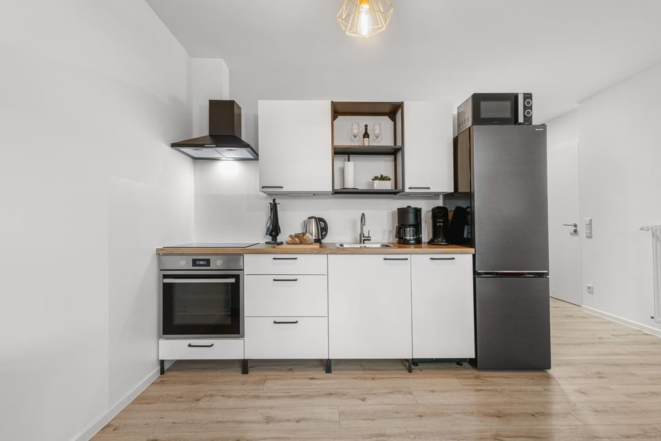 Kitchen or kitchenette, dishwasher, oven, stove, toaster