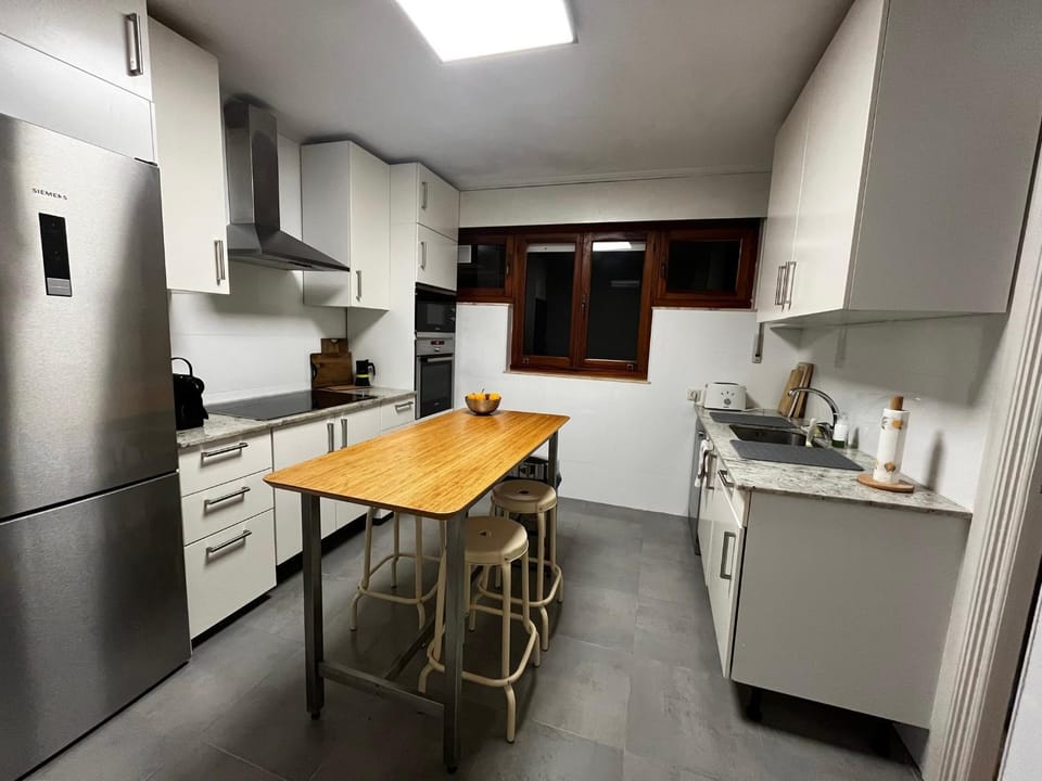 Kitchen or kitchenette, dishwasher, oven, stove, toaster