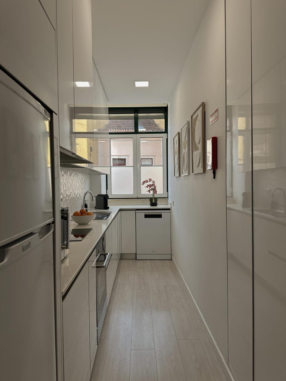 Kitchen or kitchenette, dishwasher, oven, stove
