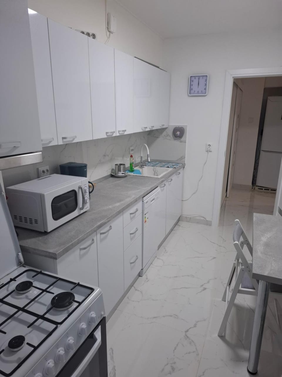 Kitchen or kitchenette, dishwasher, oven, stove, toaster