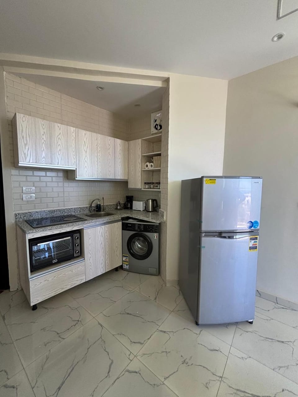 Kitchen or kitchenette, oven, stove, washing machine