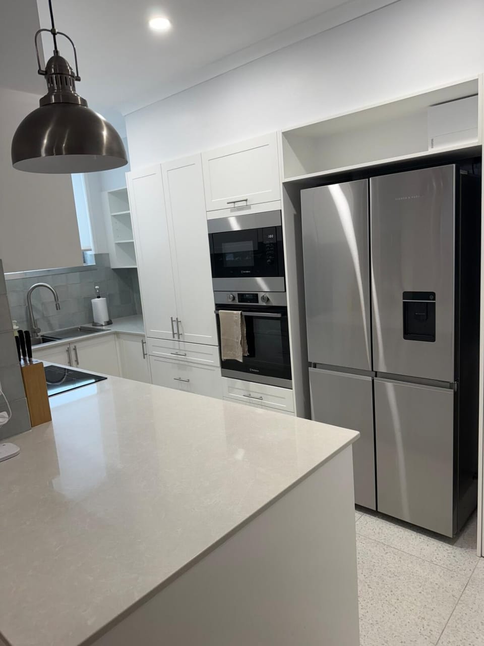 Kitchen or kitchenette, dishwasher, oven, stove