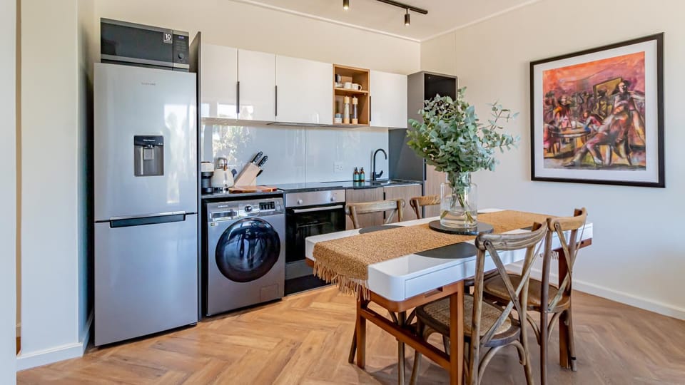 Kitchen or kitchenette, oven, stove, toaster, washing machine, dryer