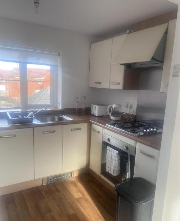 Kitchen or kitchenette, stove, toaster