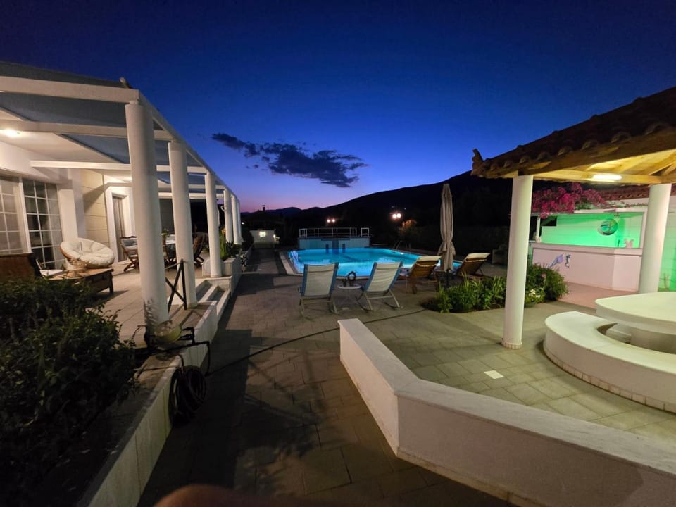 Property building, Patio, Night, Natural landscape, Pool view, Swimming pool, sunbed